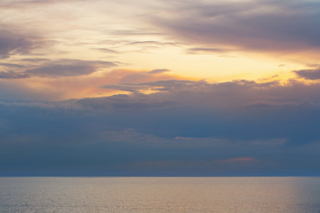 beautiful sky with clouds and sea at sunset
