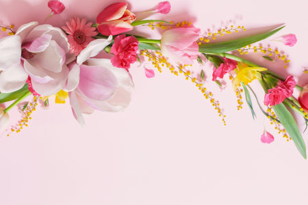 beautiful spring flowers on pink background