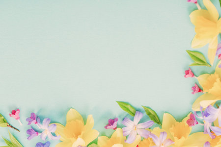 spring flowers on green paper background