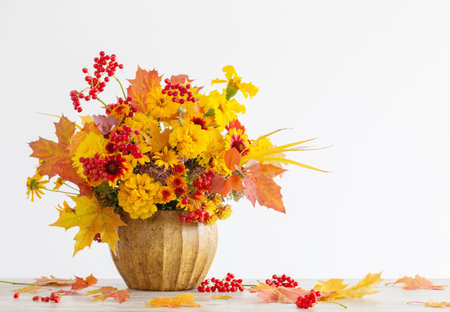 autumnal bouquet in ceramic vase on white backgroundの写真素材