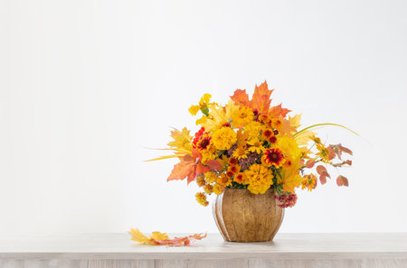 autumnal bouquet in ceramic vase on white backgroundの写真素材
