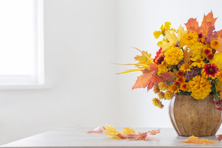 autumnal bouquet in ceramic vase on white backgroundの写真素材