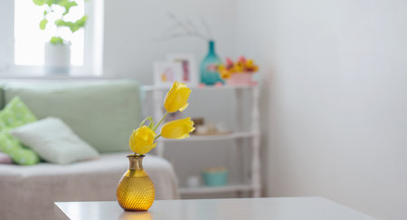white home interior with spring flowers and decorationsの写真素材