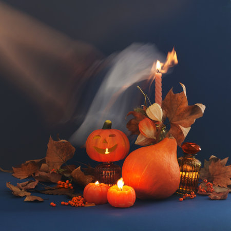 halloween decor with pumpkins on dark blue backgroundの写真素材