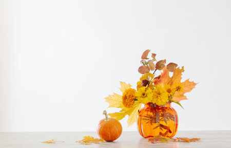 orange autumnal bouquet on white backgroundの写真素材