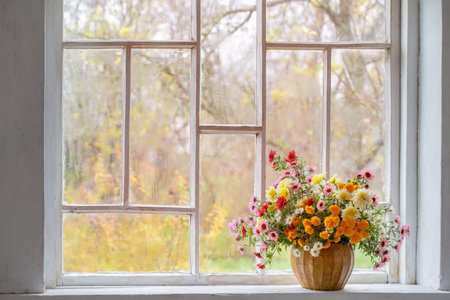 bouquet of colorful chrysanthemums in vase in white old interior