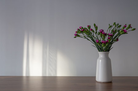 bouquet of purple carnation on background wall