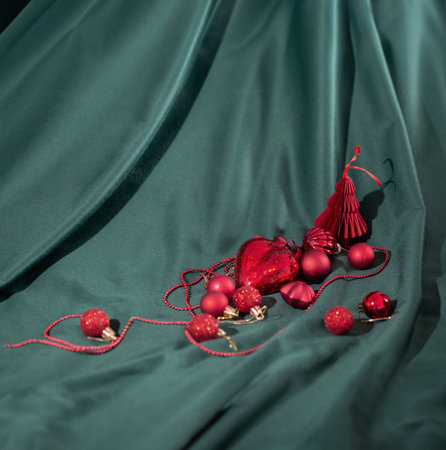 red christmas toys on green velvet backgroundの写真素材