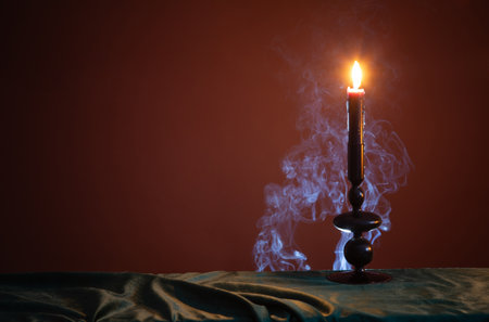 burning candles on dark backgroundの写真素材