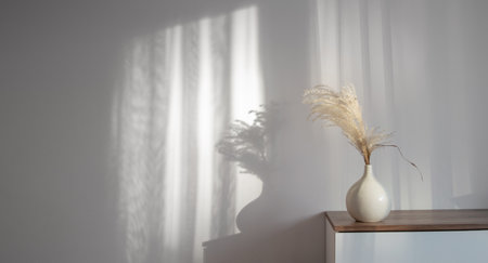 dry cereal ornamental plants in vase on background white wallの写真素材