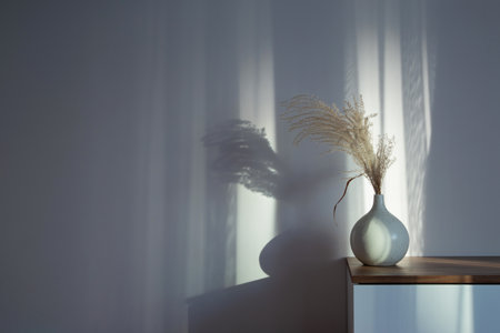 dry cereal ornamental plants in vase on background white wallの写真素材