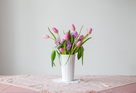 spring flowers in white vase in vintage styleの写真素材
