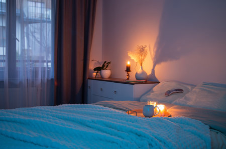 cup of tea in bedroom at nightの写真素材