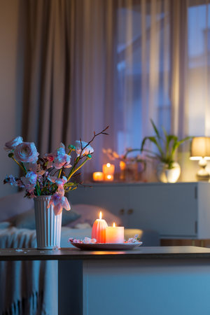 home interior with spring flowers and burning candlesの写真素材