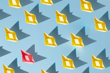 pattern of one pink boat and yellow boats on blue background