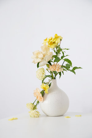 beautiful bouquet in white vase in white interiorの写真素材