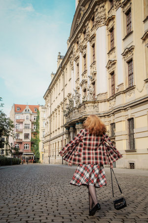 young beautiful woman in vintage suit in European cityの写真素材