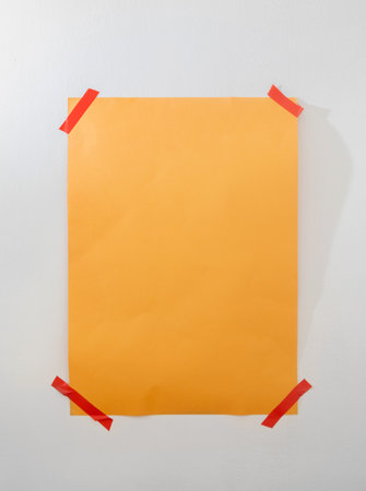 orange sheet on background white wallの写真素材