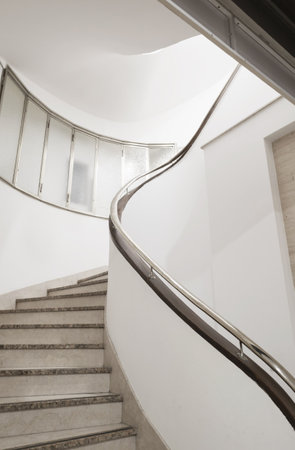 round modern stair in white interiorの写真素材