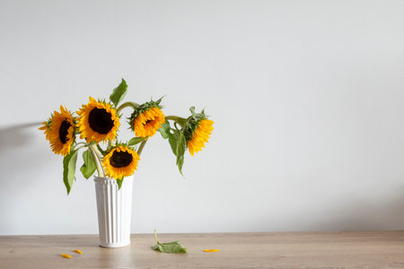 summer bouquet with sunflowers on background white wallの写真素材