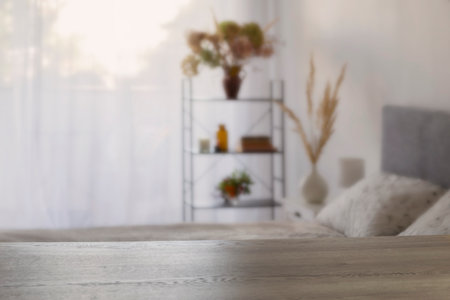 wooden table on background white bedroomの写真素材