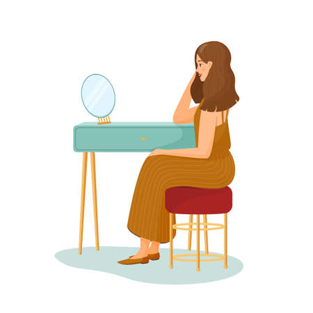 Young woman sits at the dressing table and looks in the mirror. Girl in a striped skirt. Vector illustration on white background. primping hair. Morning routine, start day, everyday life. Flat cartoonのイラスト素材