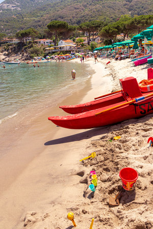 Sant Andrea, Elba Island, Italy - 06 June 2022 Tourists enjoying white sandy beach perfect for snorkeling and relaxation at Sant Andrea, Elba Island, Italyのeditorial素材
