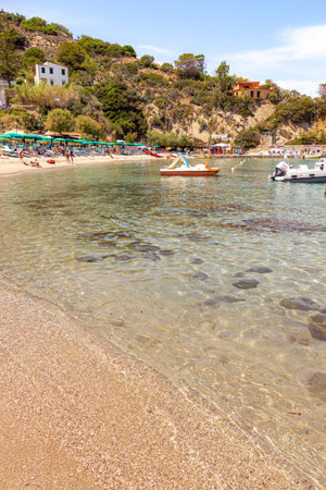 Sant Andrea, Elba Island, Italy - 06 June 2022 Tourists enjoying white sandy beach perfect for snorkeling and relaxation at Sant Andrea, Elba Island, Italyのeditorial素材