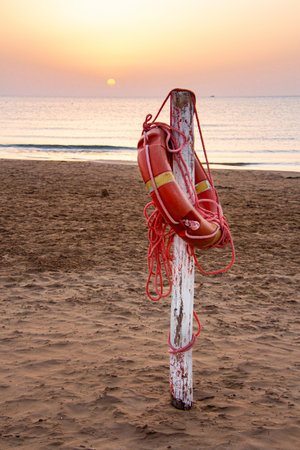 lifebuoy at sandy beach at Vieste, Gargano, Apulia, Italyの写真素材