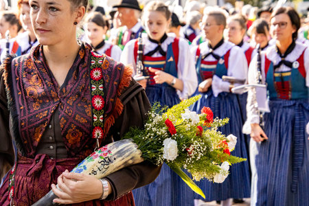 Merano, South Tyrol, Italy - 15 October 2023 Traditional parade of music bands at grape festival