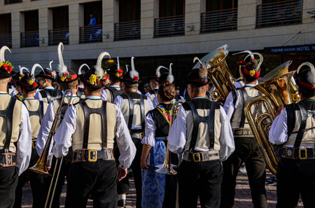 Meran, South Tyrol, Italy - 15 October 2023 Traditional parade of music bands at grape festivalのeditorial素材