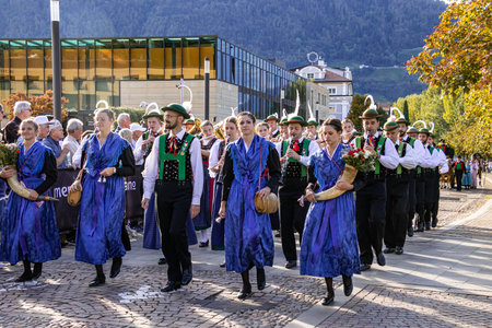 Meran, South Tyrol, Italy - 15 October 2023 Traditional parade of music bands at grape festival