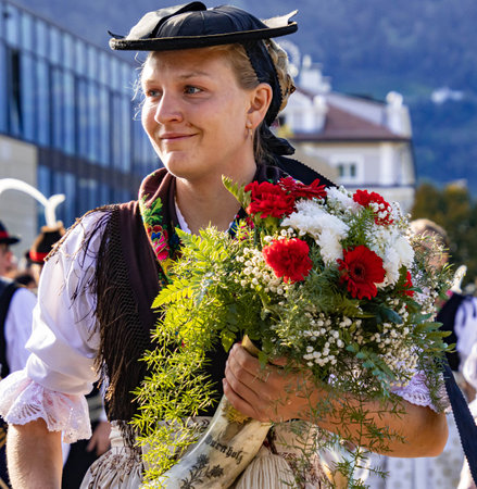 Merano, South Tyrol, Italy - 15 October 2023 Traditional parade of music bands at grape festivalのeditorial素材