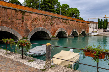 View at Ponte dei voltoni and canale di mezzo at Peschiera, Lago del Garda, Italyの写真素材