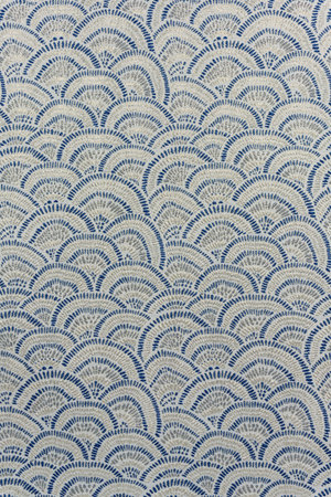 Close-up of decorative light silver-gray jacquard fabric featuring the Japanese Seigaiha (blue ocean...