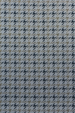 Textured background with repeating diagonal "houndstooth" (pied-de-poule) pattern in charcoal tones with gold lurex. Material for furniture upholstery, curtains, gift packaging, and design texture.の写真素材