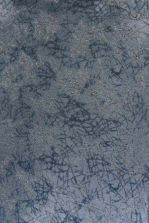 Textured background with a mother-of-pearl effect in blue-gray shades. Abstract chaotic lines in...