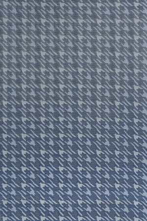 Flat woven background with a broken check pattern. The color smoothly transitions from light...