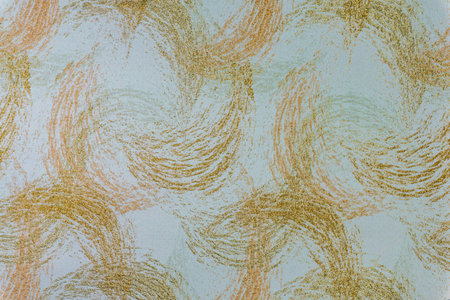 Beige fabric background with a shimmering golden wave pattern. Close-up of woven textile with glitter threads for wedding decor, luxury branding, and interior designの写真素材