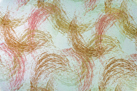 Soft pink and peach fabric background featuring a decorative wavy pattern with rose gold glitter. Woven material surface for feminine design, fashion, and upholstery texturesの写真素材