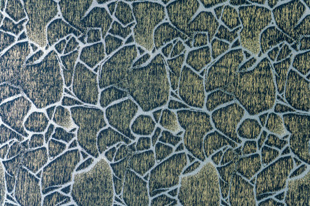Decorative denim blue cloth surface with a stone-like geometric pattern. Woven textile material with...