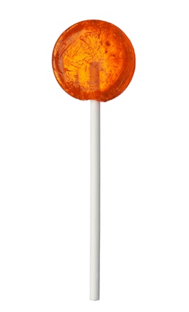 One orange lollipop isolated on white background, close-up. This image is isolated with light during the photo shoot process.の写真素材
