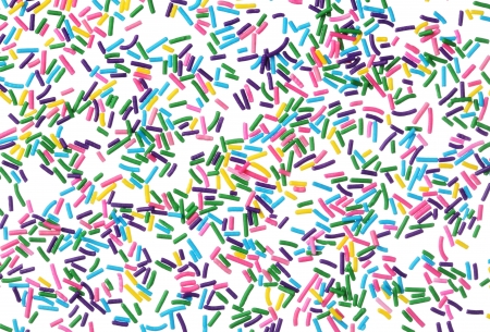 Colorful candy sprinkles isolated on white backgroundの写真素材