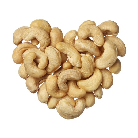 Cashew nuts heart isolated on white backgroundの写真素材