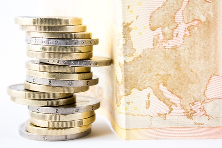 Stack of euro coins and bankの写真素材