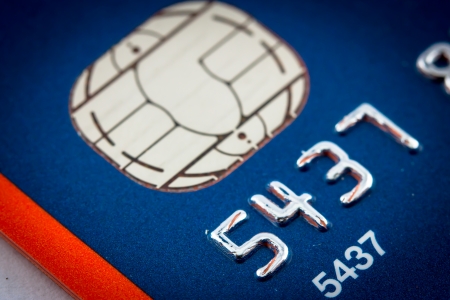 A close up of a credit card number and chipの写真素材