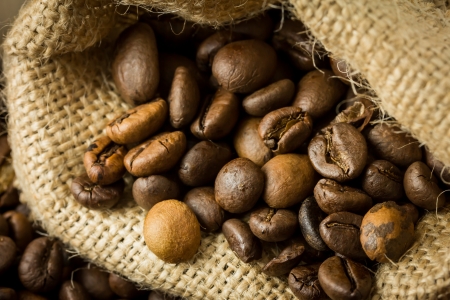 Coffee beans in a jute bagの写真素材