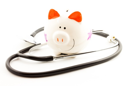 HEALTH INSURANCE PIGGY BANK with stethoscopeの写真素材