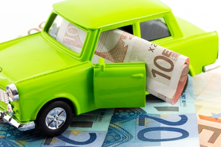 Green car over euro notes の写真素材