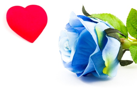 Blue rose and a heart on the backgroundの写真素材